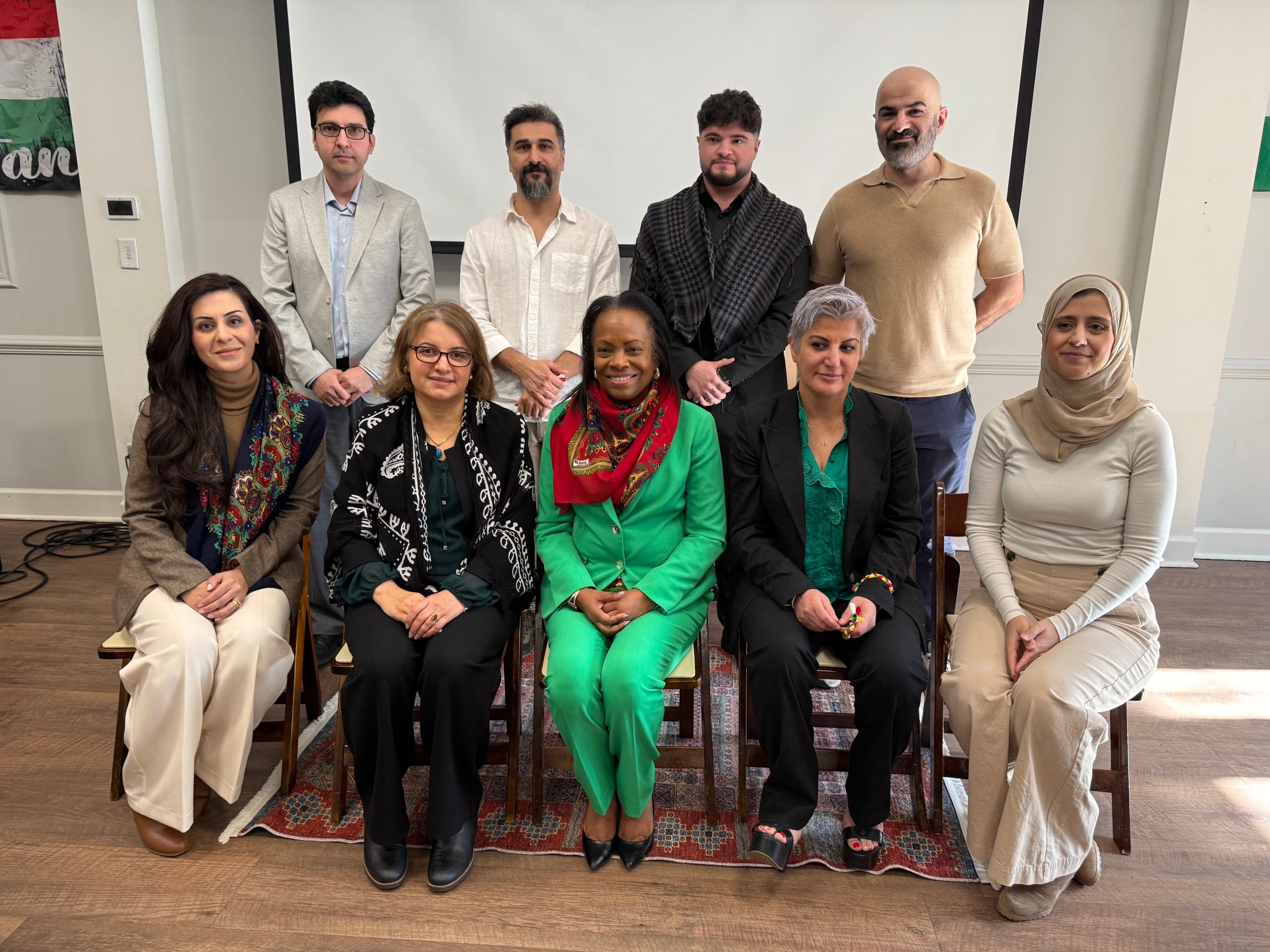 Organizers of the Kurdish Tea Time take a photo with City of Clarkston Mayor Beverly Burkes (seated center).